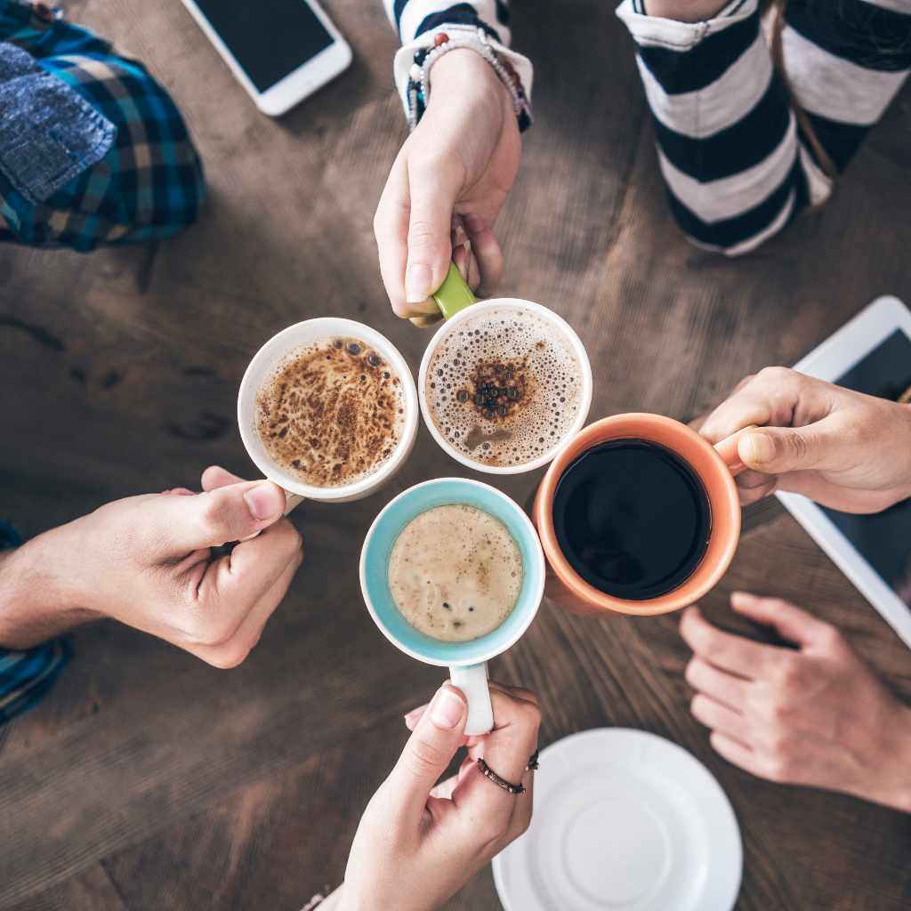 Professionals enjoying barista-style coffee through workplace coffee service