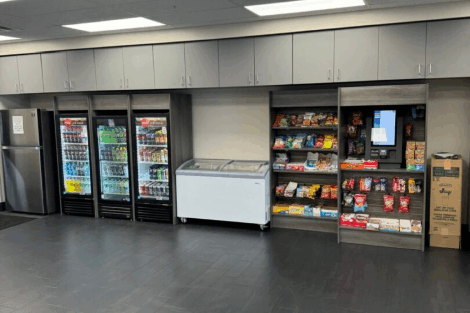 “Modern self-serve micro market in a Nashville workplace with snacks, drinks, and coolers.”